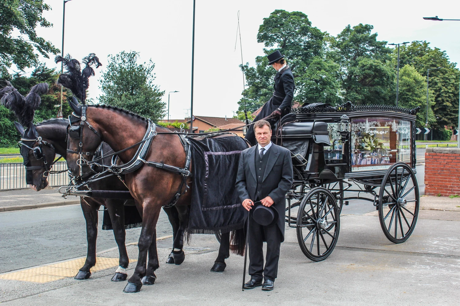 K. Dixon Funerals with a traditional horse-drawn hearse and two horses