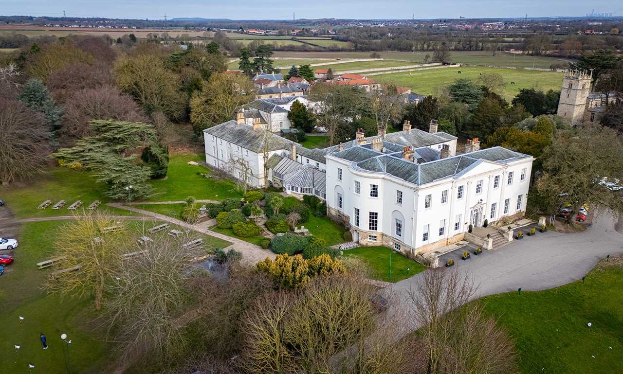Owston Hall country house and its surrounding grounds
